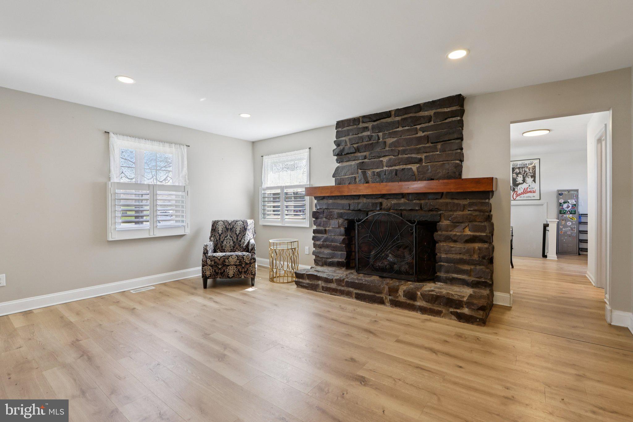 351 Merrick Road Robbinsville, NJ 08691 - Photo 27 of 69 a living room with furniture and a fireplace