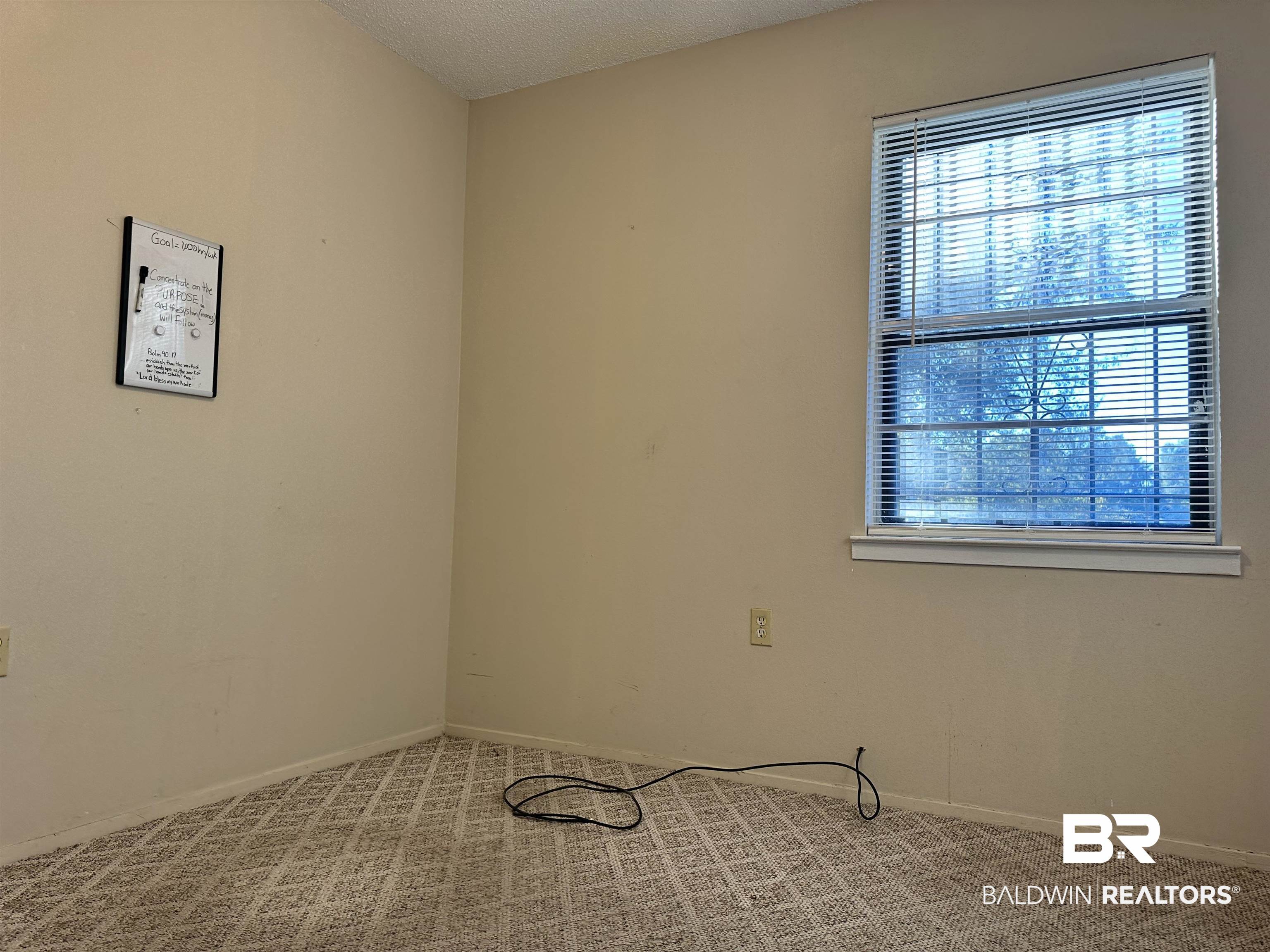 3451 Kirkland Road Brewton, AL 36426 - Photo 13 of 17 Carpeted empty room featuring a textured ceiling