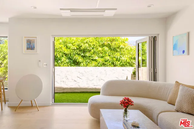 a living room with a couch and a large window