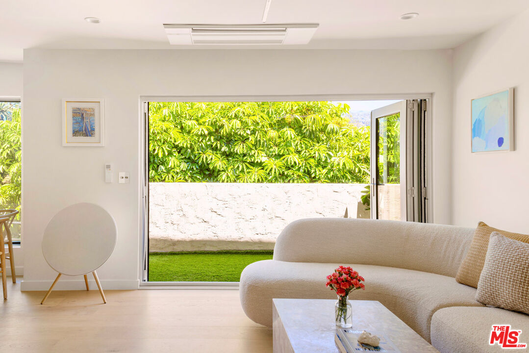 a living room with a couch and a large window