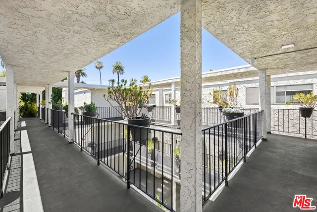 a view of house with outdoor space and tree