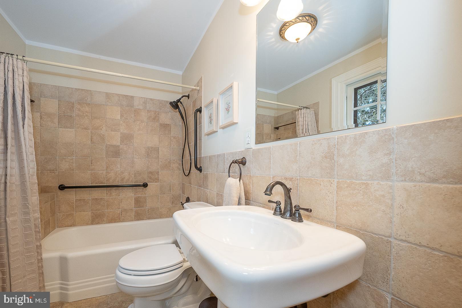 124 Grandview Road Ardmore, PA 19003 - Photo 16 of 65 a bathroom with a sink toilet and shower