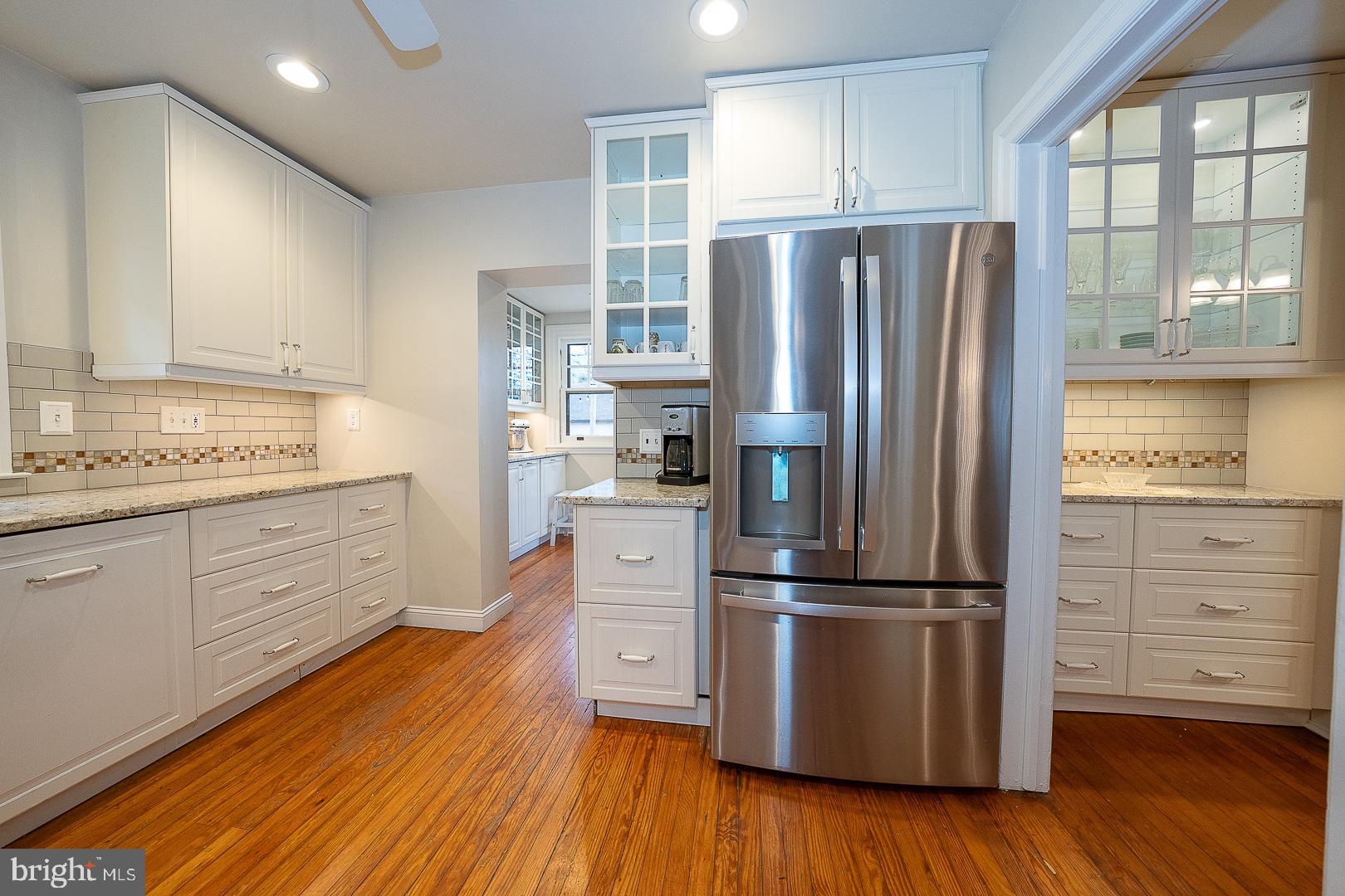 124 Grandview Road Ardmore, PA 19003 - Photo 21 of 65 a kitchen with stainless steel appliances a refrigerator cabinets and wooden floor