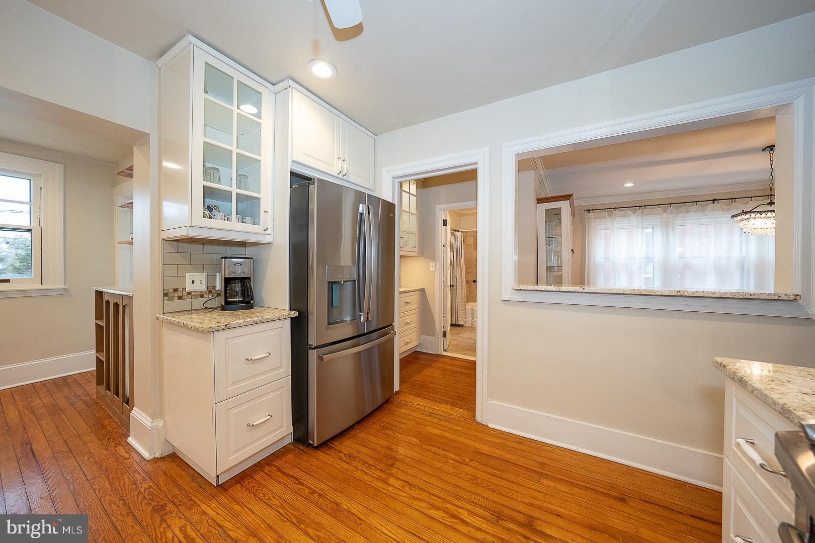 124 Grandview Road Ardmore, PA 19003 - Photo 22 of 65 a kitchen with granite countertop wooden floors and stainless steel appliances