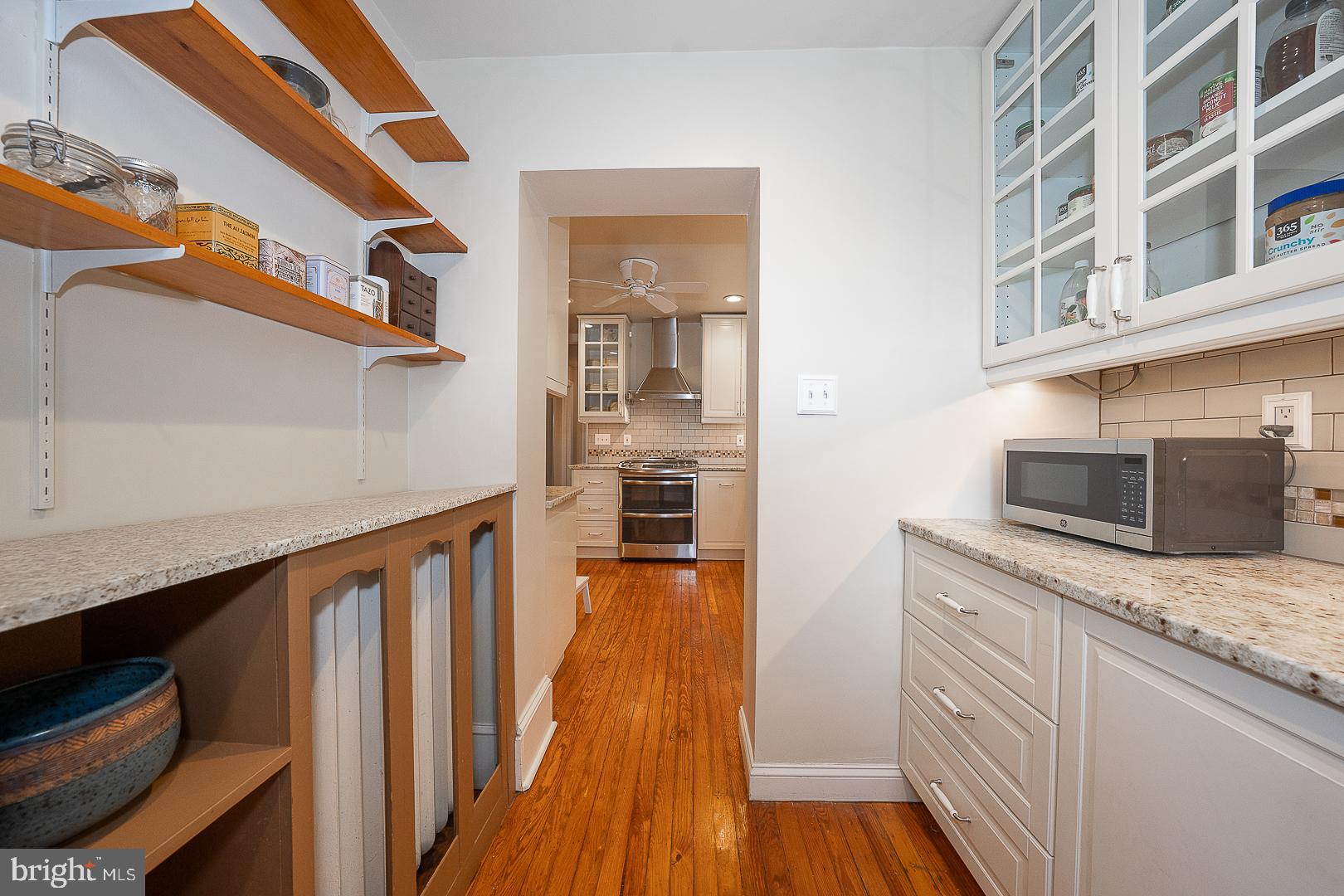 124 Grandview Road Ardmore, PA 19003 - Photo 25 of 65 a kitchen with kitchen island granite countertop a sink and wooden floor
