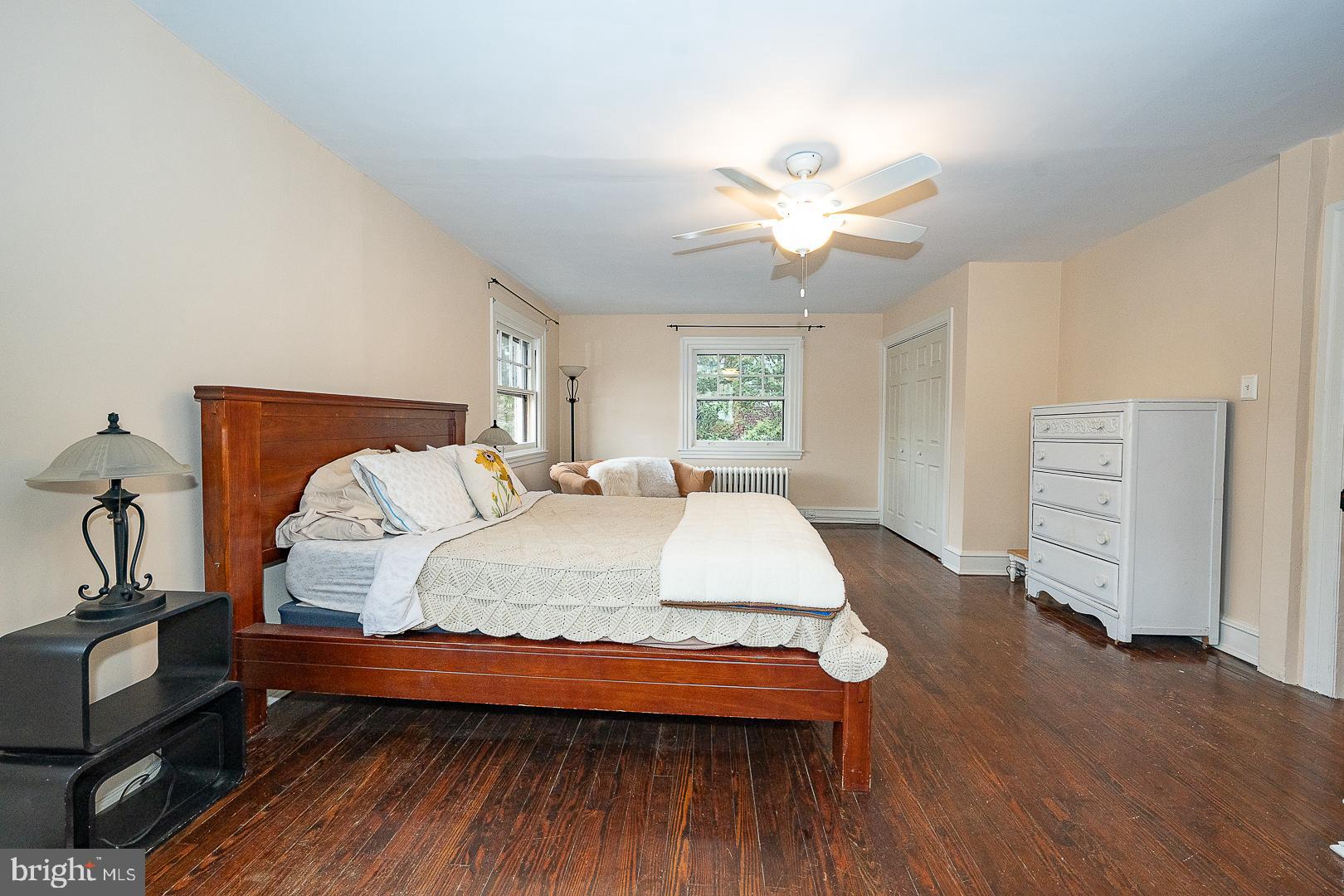 124 Grandview Road Ardmore, PA 19003 - Photo 31 of 65 a spacious bedroom with a bed and a chandelier