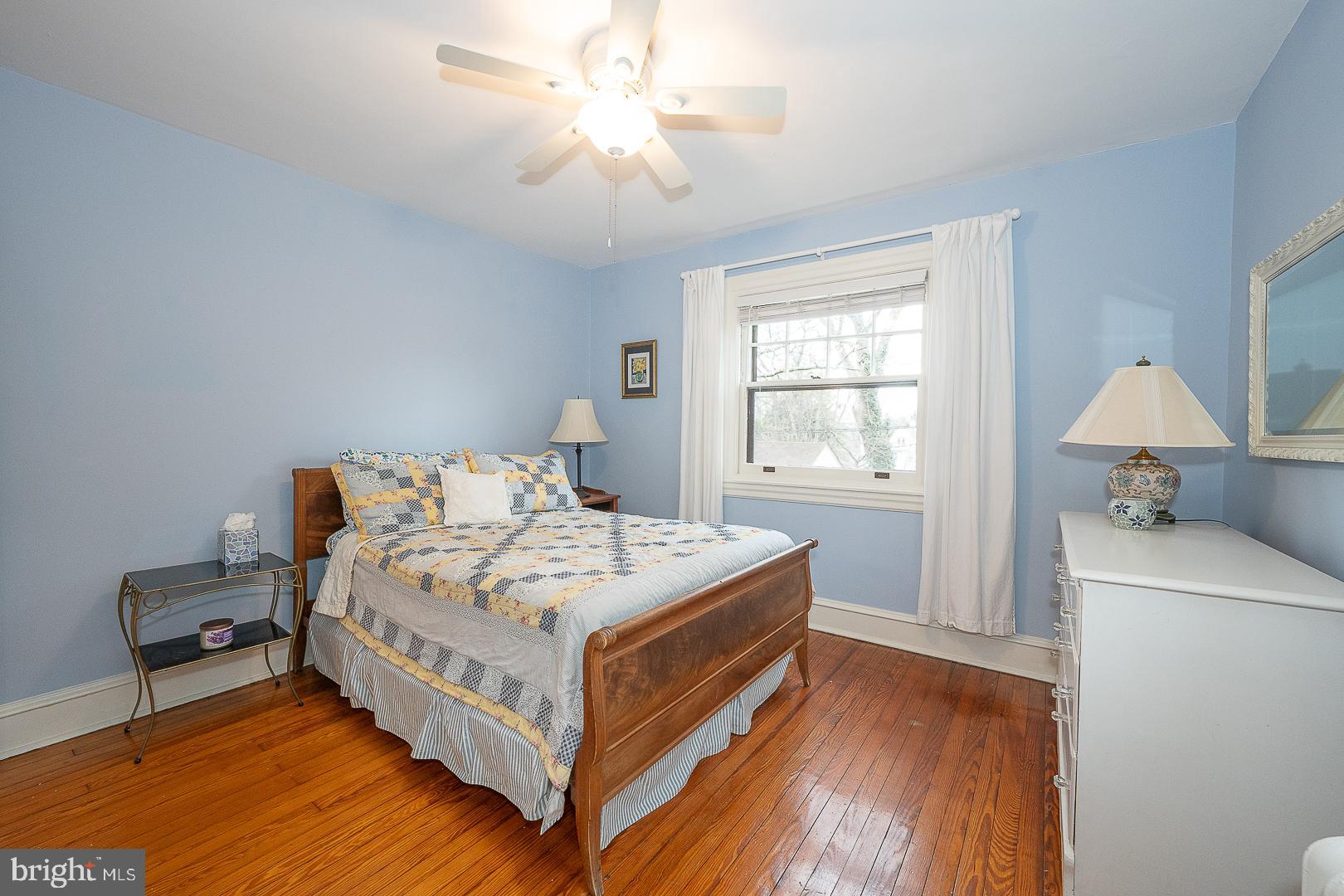124 Grandview Road Ardmore, PA 19003 - Photo 36 of 65 a white bed sitting in a bedroom next to a window