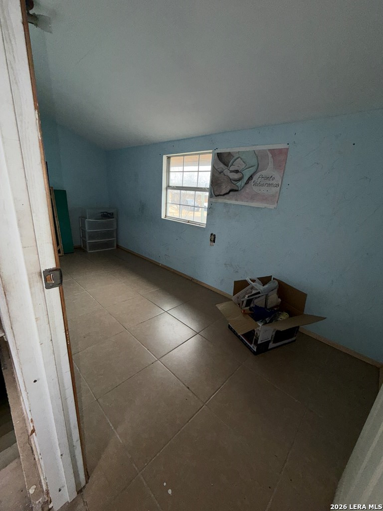 3148 Leonel Street Eagle Pass, TX 78852 - Photo 8 of 18 a room with a baby crib and a window