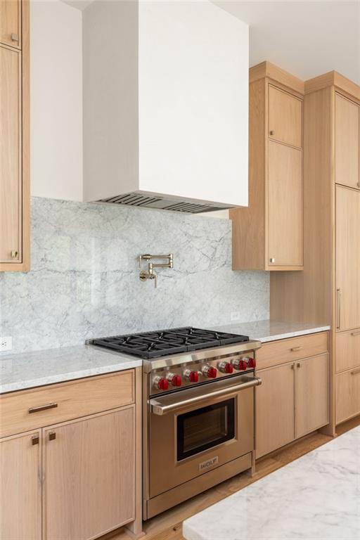 1064 Lupo Loop Chattahoochee Hills, GA 30268 - Photo 16 of 40 a kitchen with stainless steel appliances a stove and white cabinets