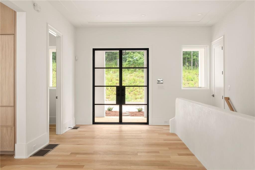 1064 Lupo Loop Chattahoochee Hills, GA 30268 - Photo 2 of 40 a view of an empty room with a window