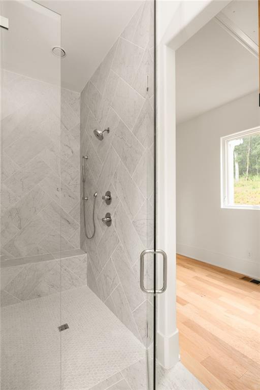 1064 Lupo Loop Chattahoochee Hills, GA 30268 - Photo 25 of 40 a bathroom with a bathtub