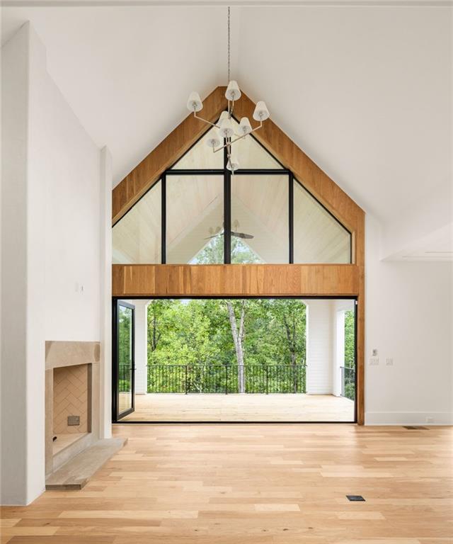 1064 Lupo Loop Chattahoochee Hills, GA 30268 - Photo 5 of 40 a view of a room with a window and wooden floor