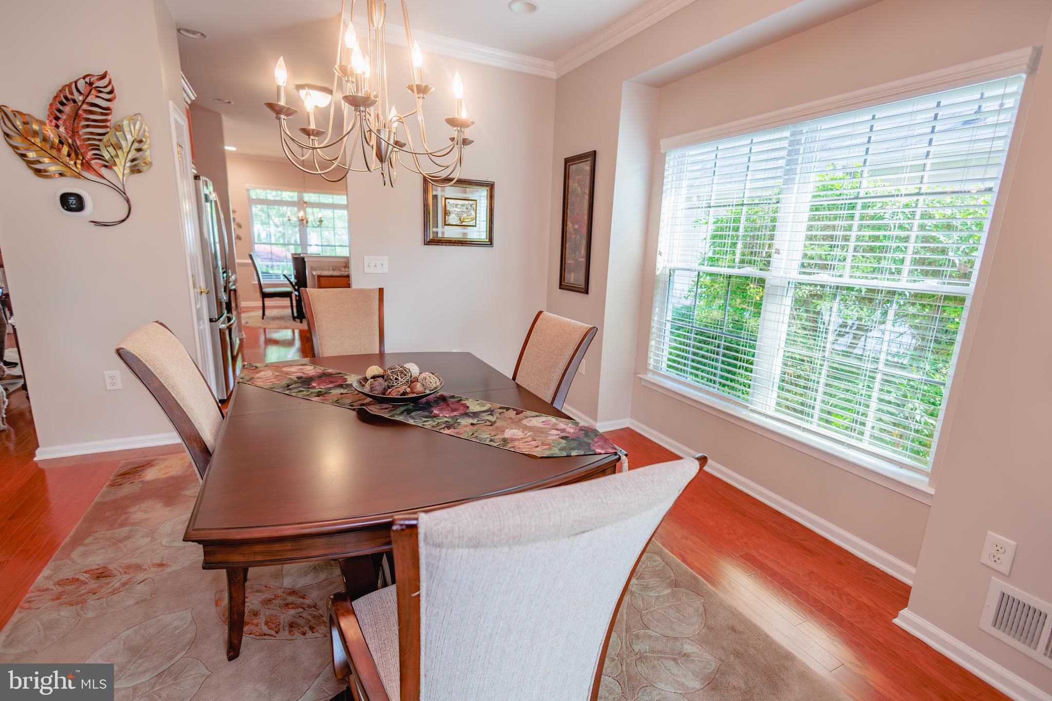 302 Gosling Way Glassboro, NJ 08028 - Photo 13 of 37 a view of a dining room with furniture and a chandelier