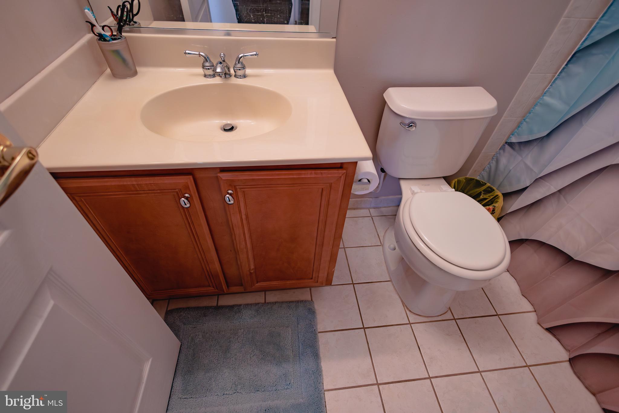 302 Gosling Way Glassboro, NJ 08028 - Photo 28 of 37 a bathroom with a sink toilet and mirror