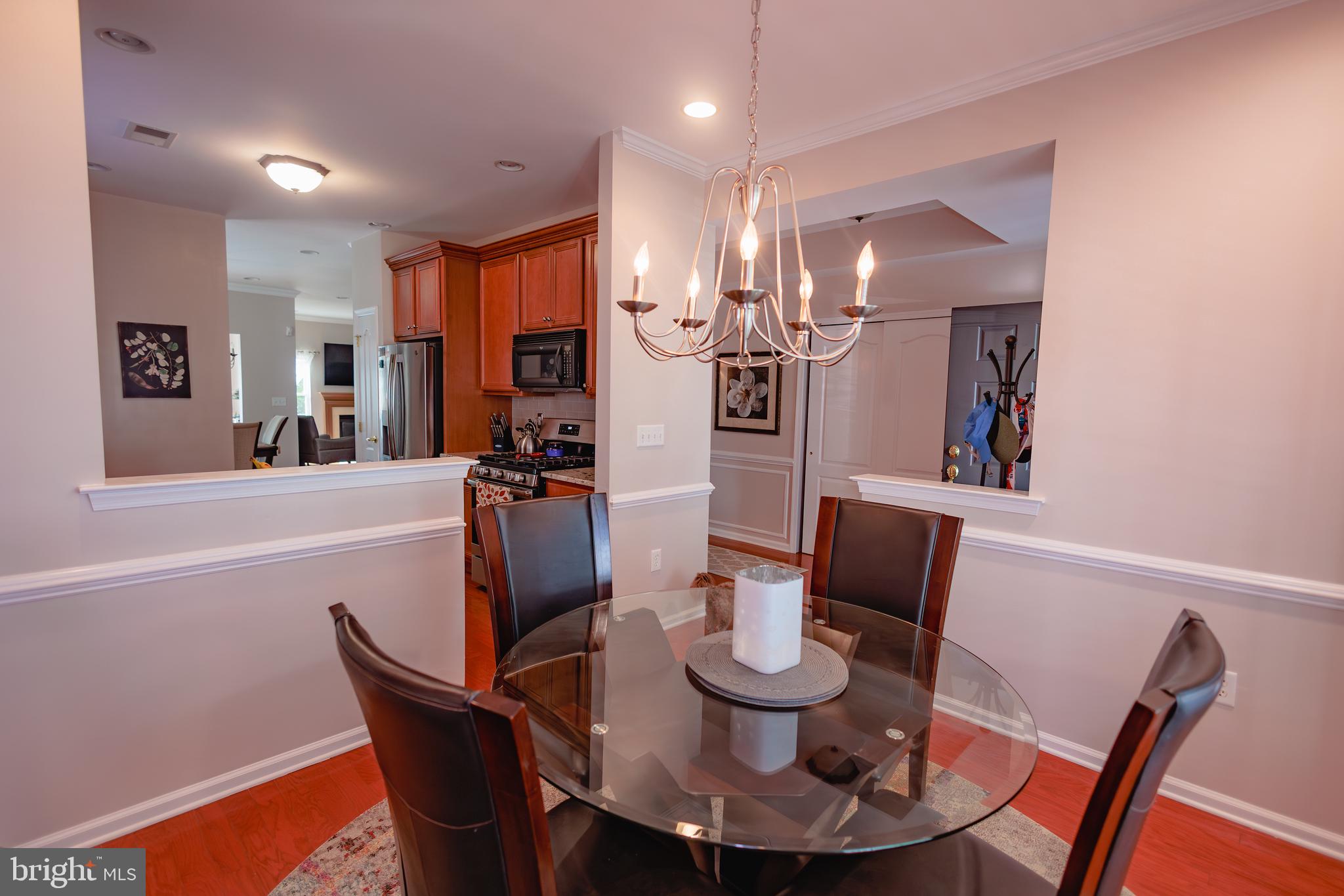 302 Gosling Way Glassboro, NJ 08028 - Photo 7 of 37 a dining room with furniture and wooden floor