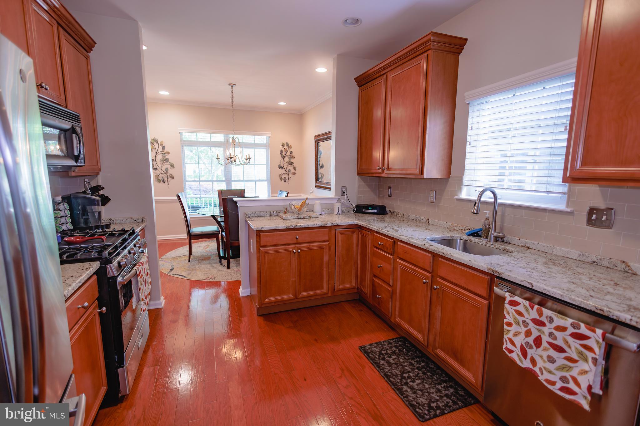 302 Gosling Way Glassboro, NJ 08028 - Photo 10 of 37 a kitchen with stainless steel appliances granite countertop a sink stove and cabinets