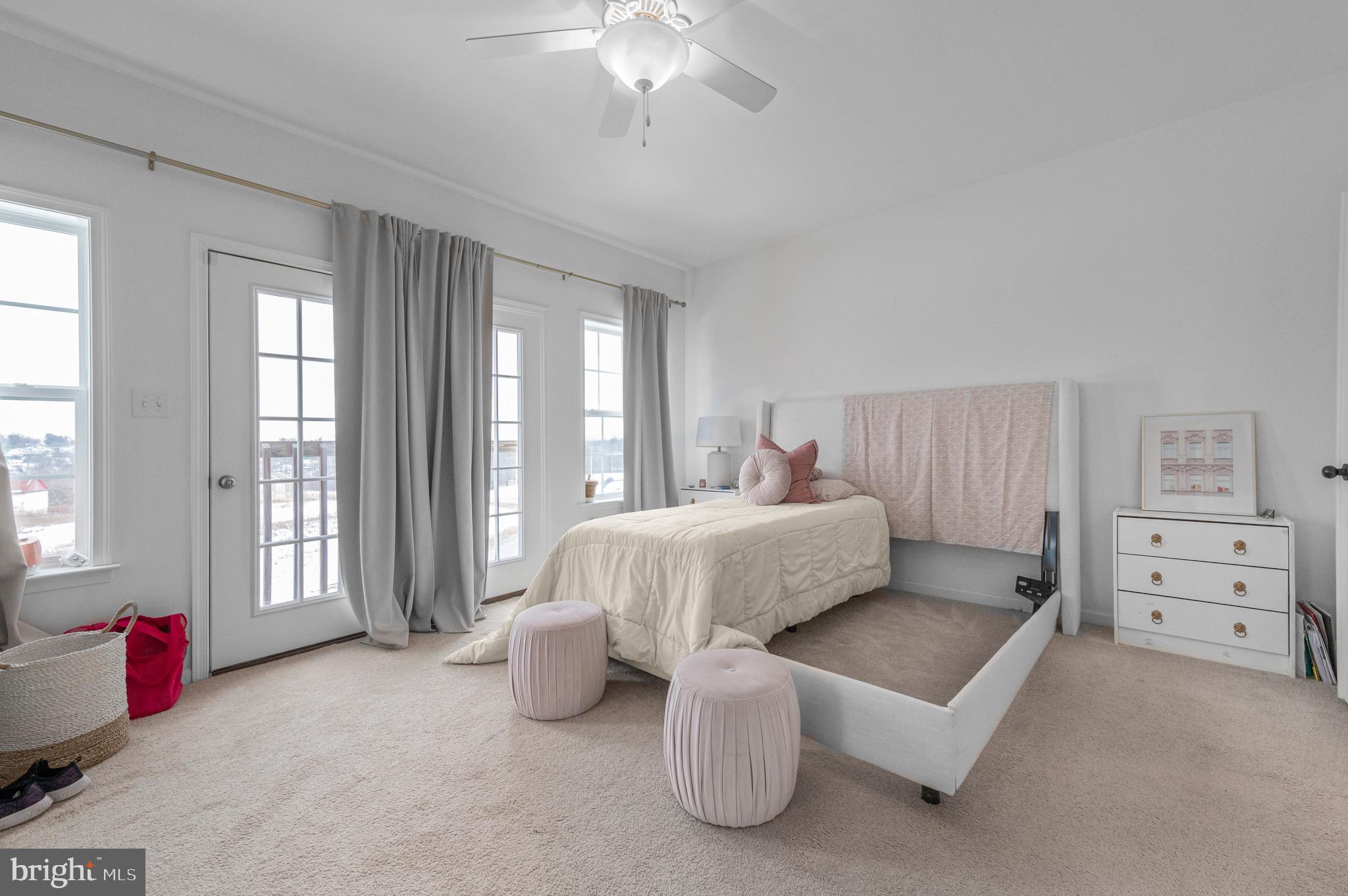 2004 Prout Farm Road Pottstown, PA 19464 - Photo 26 of 53 a spacious bedroom with a bed and a chandelier