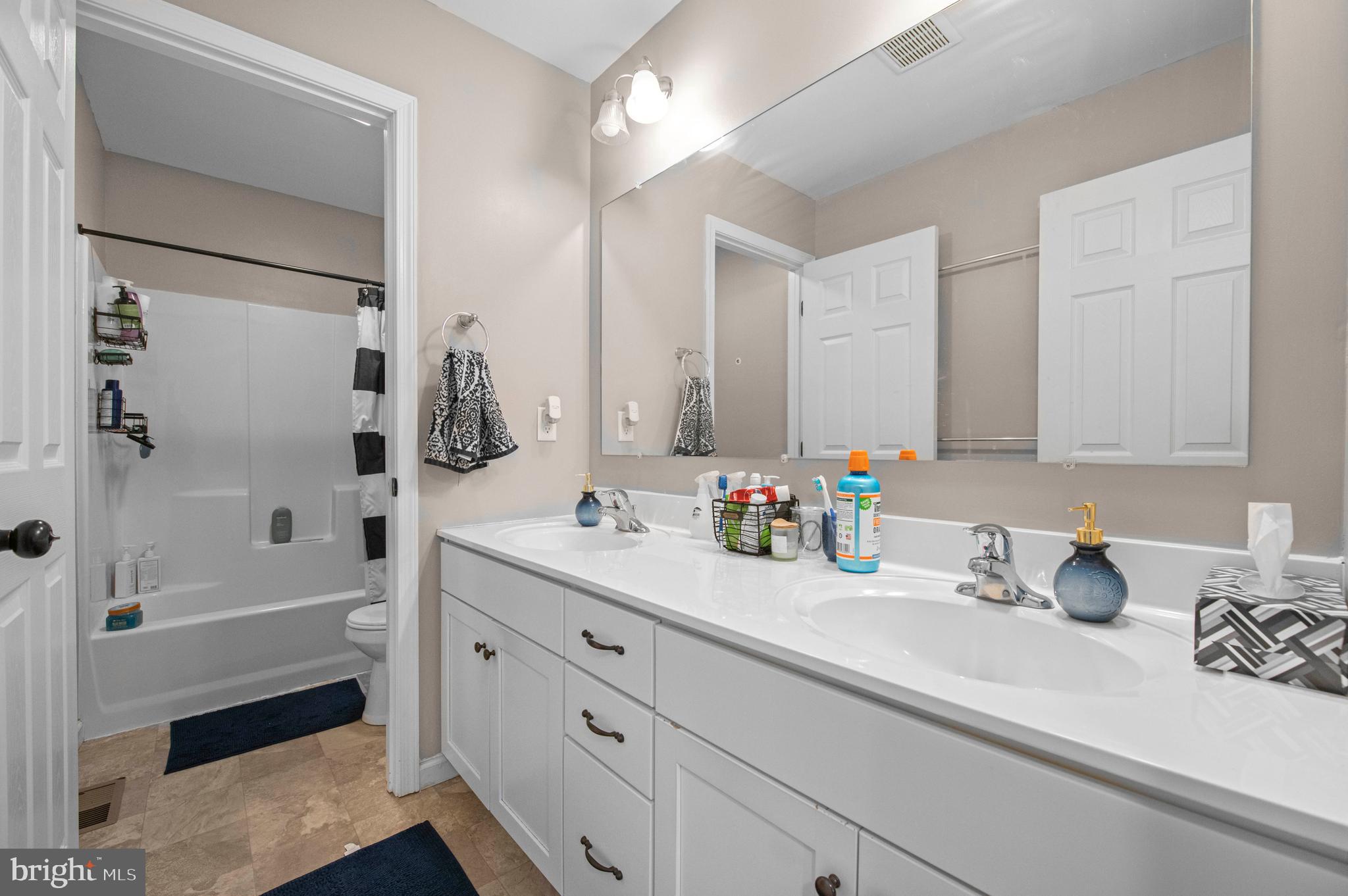 2004 Prout Farm Road Pottstown, PA 19464 - Photo 44 of 53 a bathroom with a sink double vanity granite tub shower and a mirror