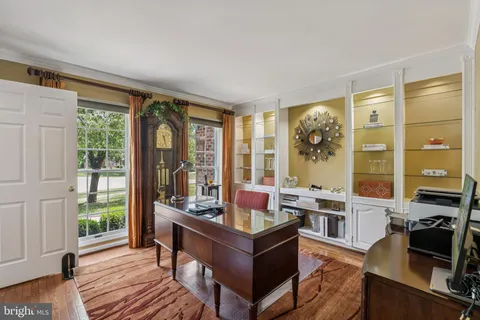 a living room with furniture and large windows
