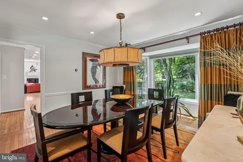 a dining room with furniture window wooden floor