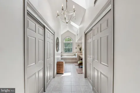 a bathroom with a granite countertop sink mirror vanity and toilet