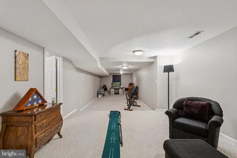 a kitchen with granite countertop a sink cabinets and stainless steel appliances