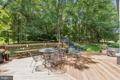 a view of a patio with a table chairs and a patio