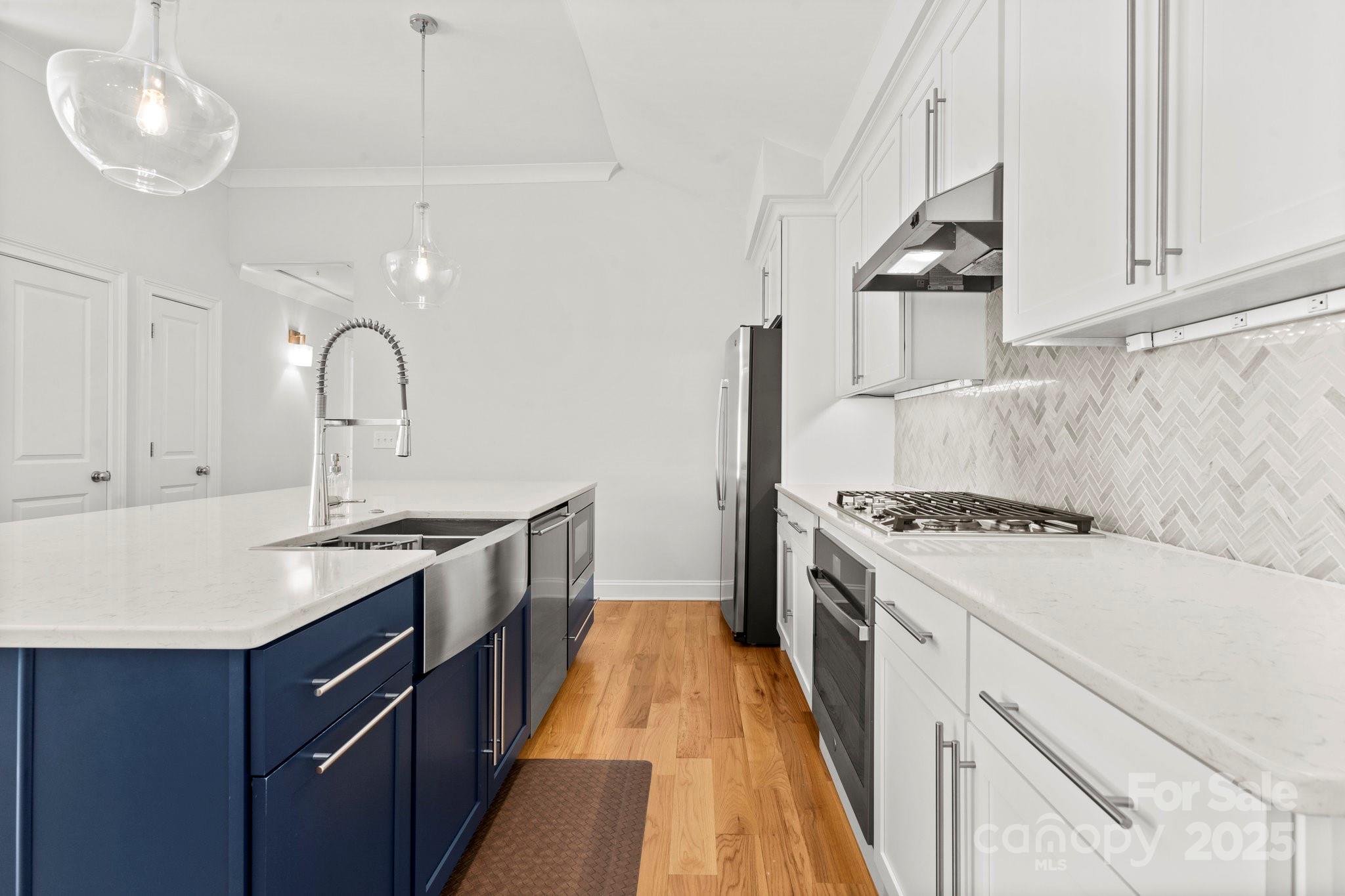 4816 Fairheath Road Charlotte, NC 28210 - Photo 15 of 35 a kitchen with a sink stove and cabinets