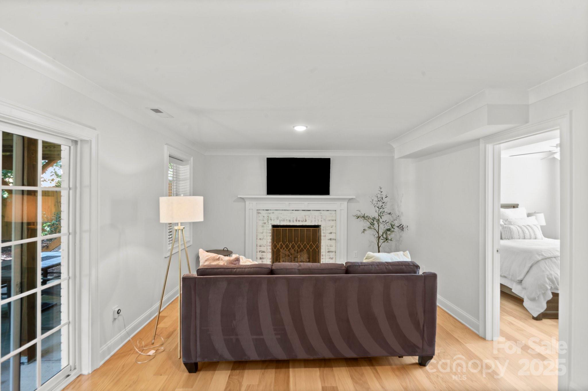 4816 Fairheath Road Charlotte, NC 28210 - Photo 19 of 35 a living room with furniture and a fireplace