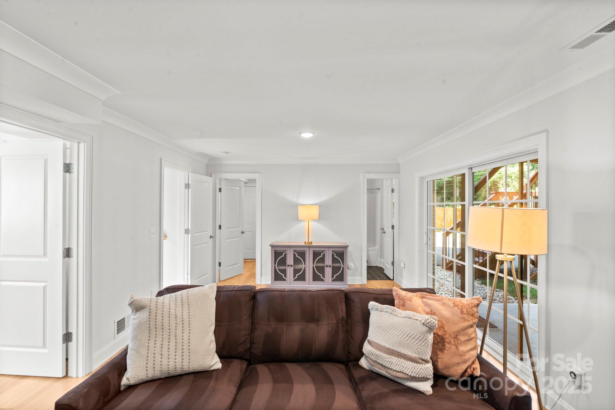 4816 Fairheath Road Charlotte, NC 28210 - Photo 22 of 35 a living room with furniture and a large window
