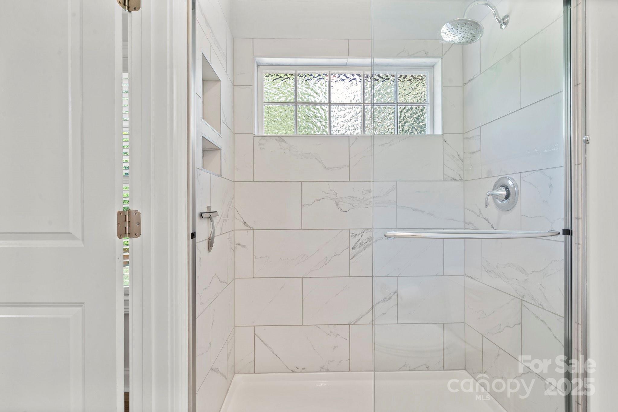 4816 Fairheath Road Charlotte, NC 28210 - Photo 28 of 35 a bathroom with a shower
