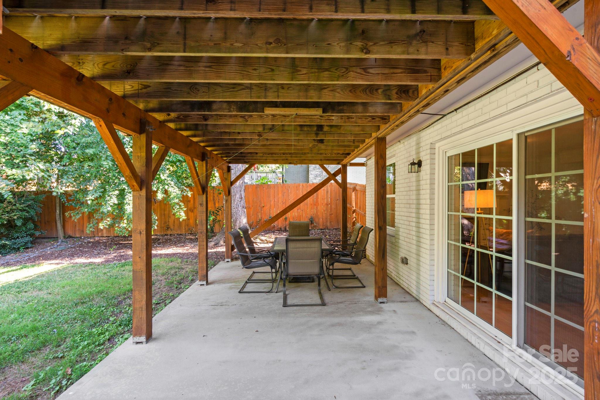 4816 Fairheath Road Charlotte, NC 28210 - Photo 29 of 35 a view of a porch with chairs and backyard