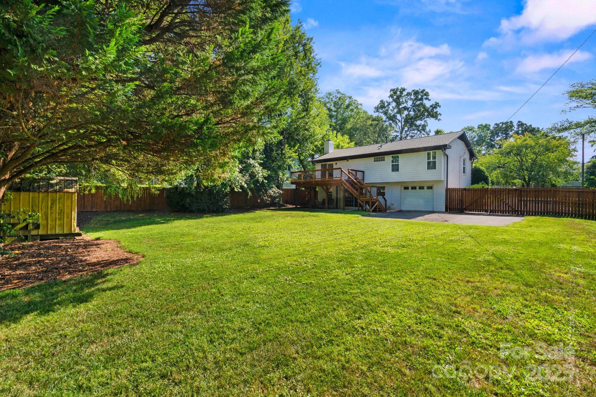 4816 Fairheath Road Charlotte, NC 28210 - Photo 32 of 35 a view of a house with yard and tree s