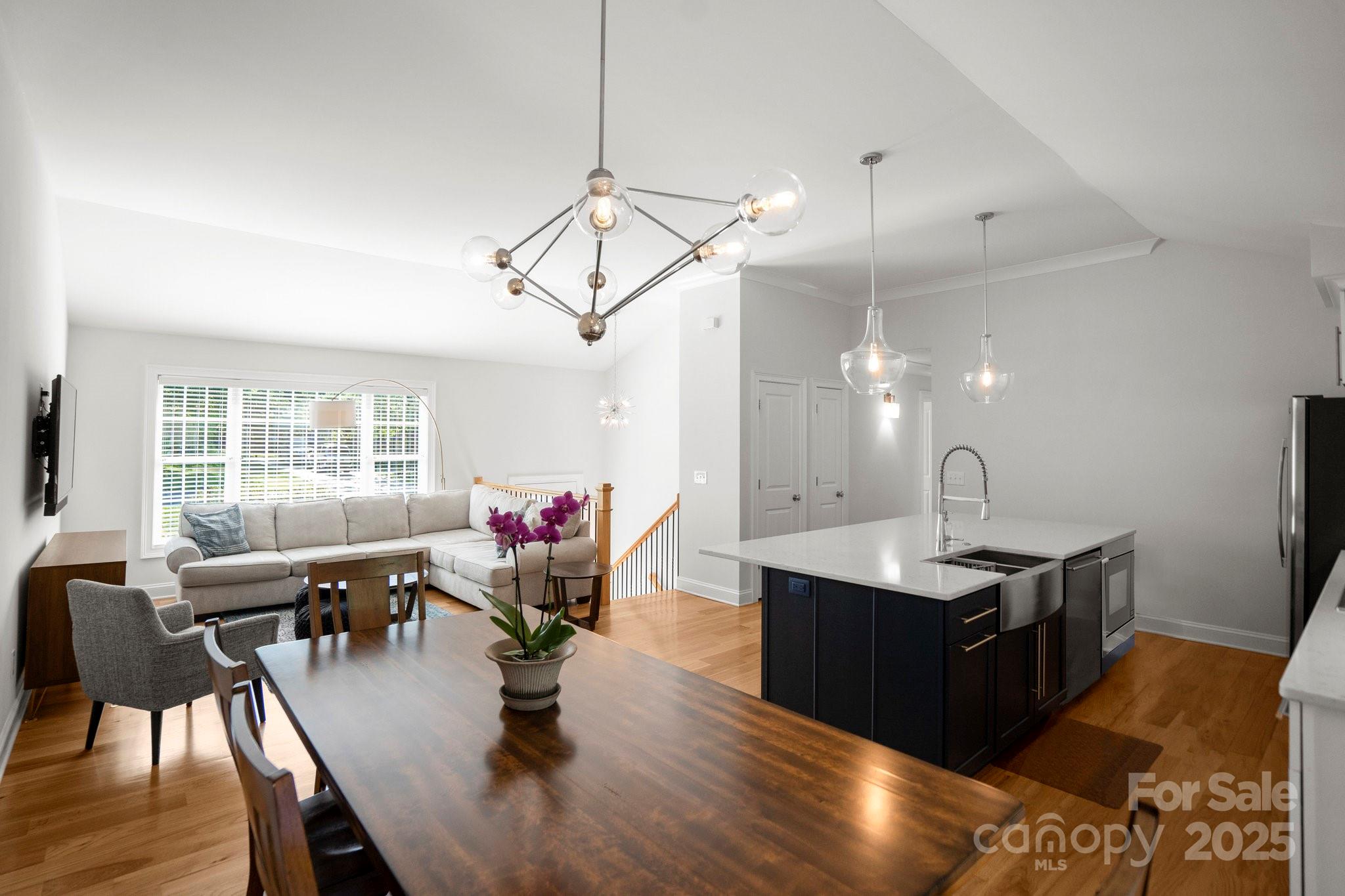 4816 Fairheath Road Charlotte, NC 28210 - Photo 7 of 35 a view of a dining room with furniture window and wooden floor