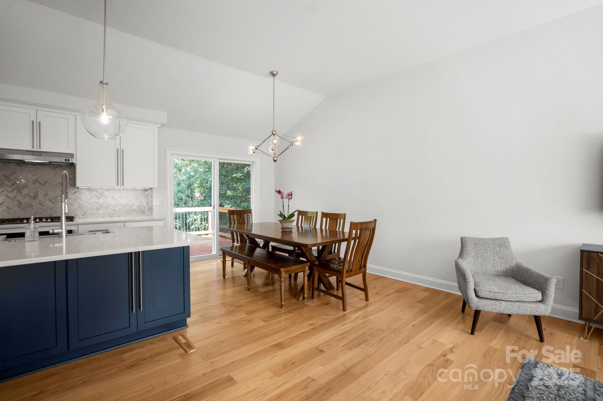 4816 Fairheath Road Charlotte, NC 28210 - Photo 8 of 35 a view of a dining room with furniture and chandelier
