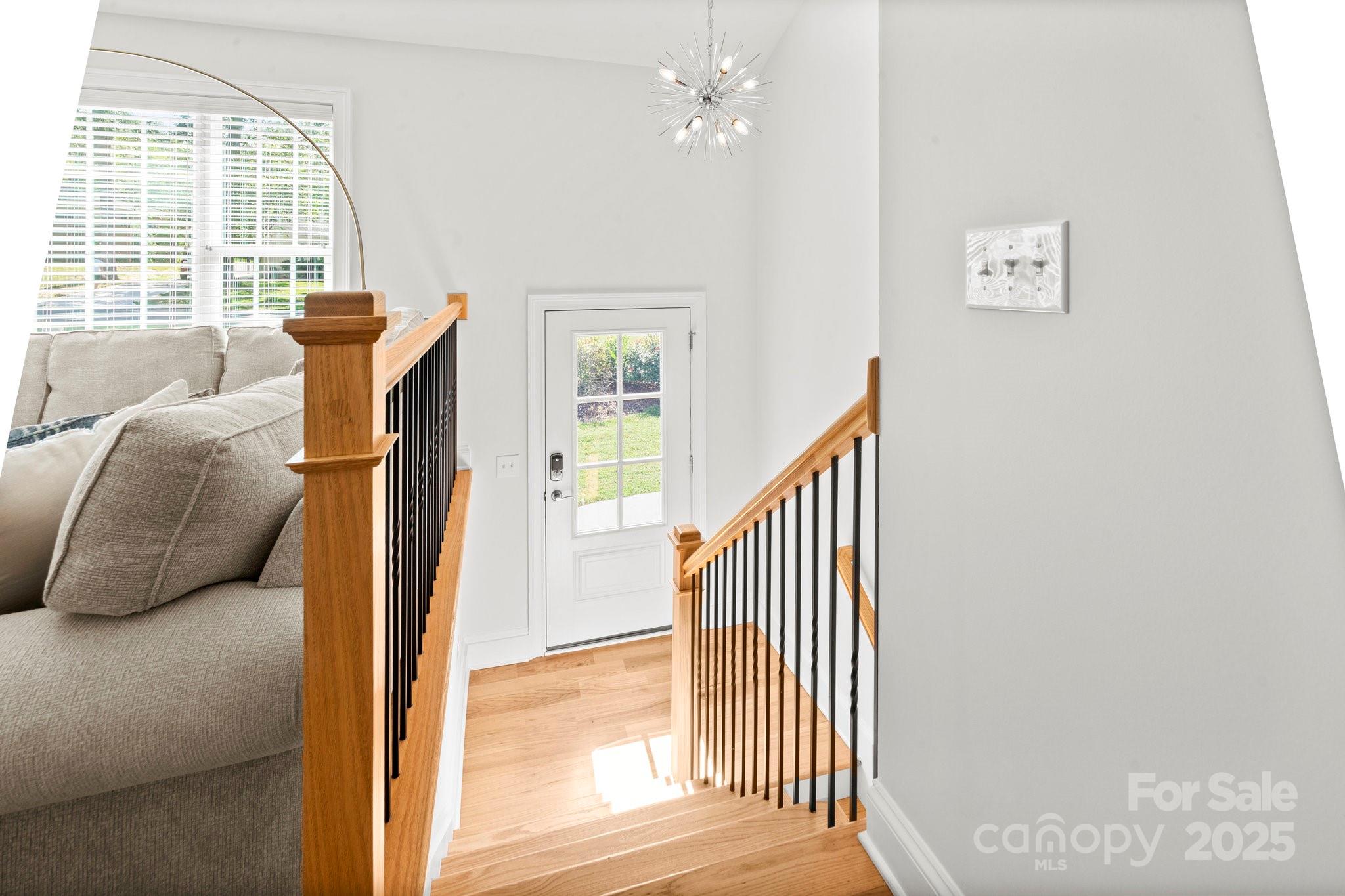 4816 Fairheath Road Charlotte, NC 28210 - Photo 9 of 35 a view of entryway and bedroom with wooden floor