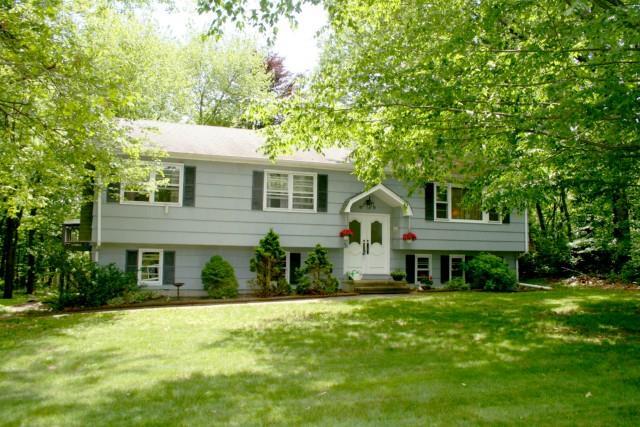 39 Ridgefield Terrace Shelton, CT 06484 - Photo 1 of 1 a front view of a house with a yard