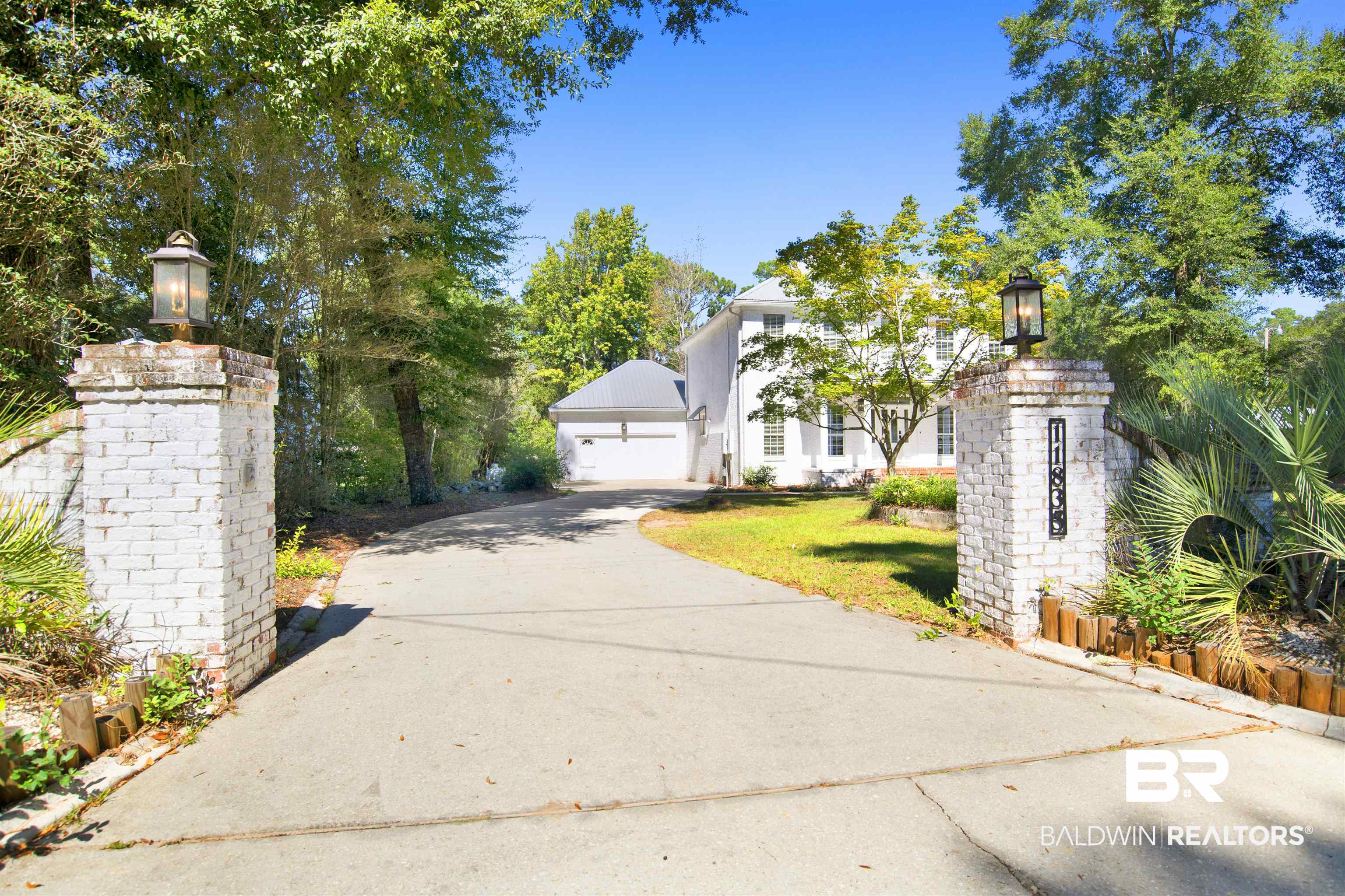 11835 Island Drive Foley, AL 36535 - Photo 50 of 53 View of front facade featuring a garage, a front lawn, and concrete driveway