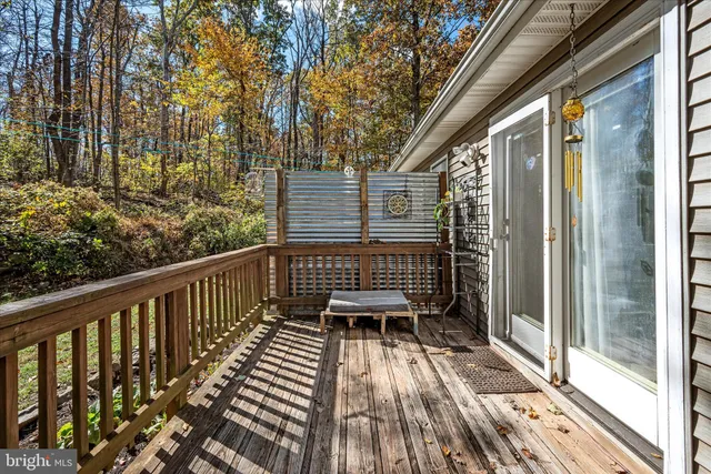 a view of balcony with wooden floor