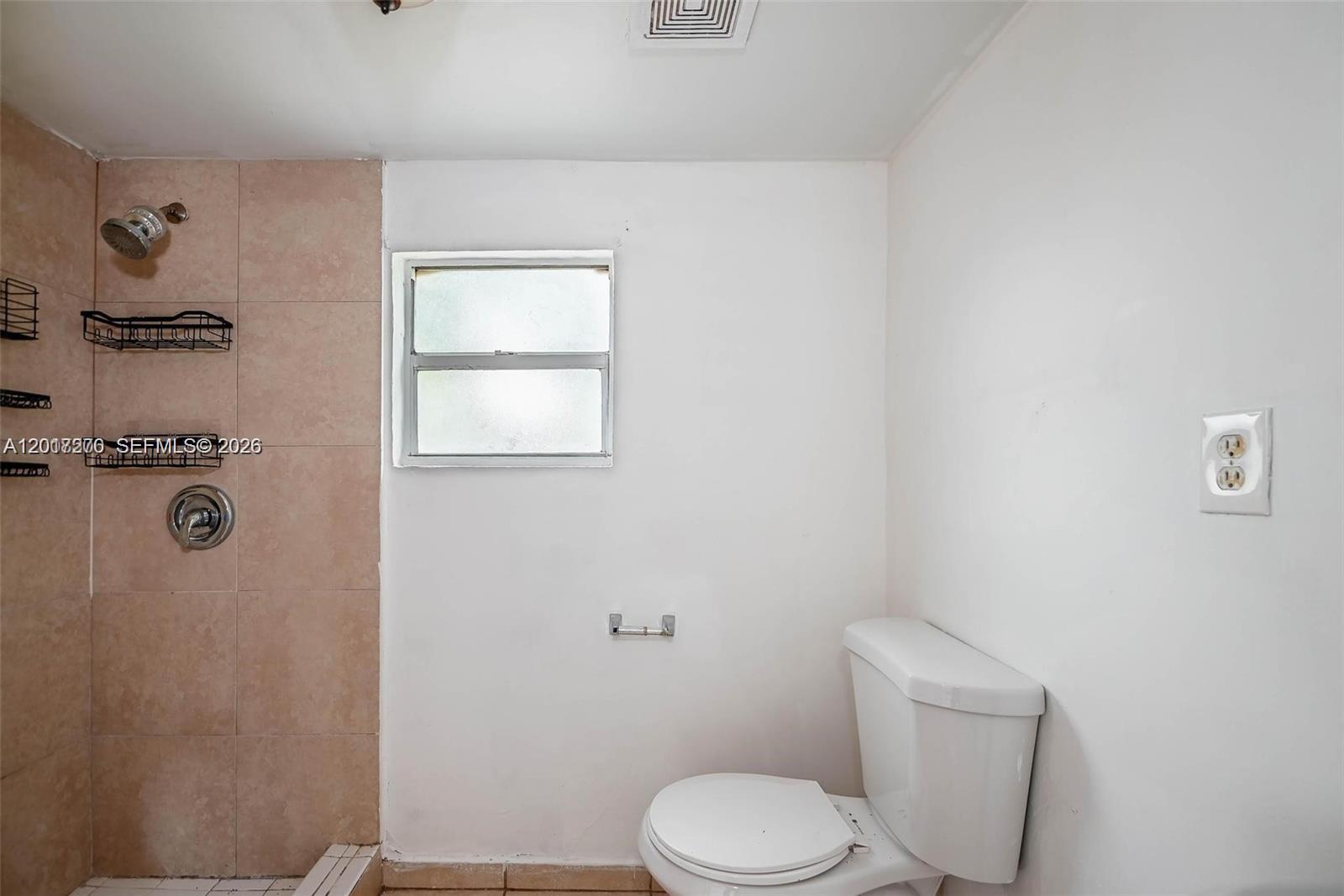 2800 Southwest 16th Terrace Miami, FL 33145 - Photo 13 of 17 a white toilet sitting next to a shower