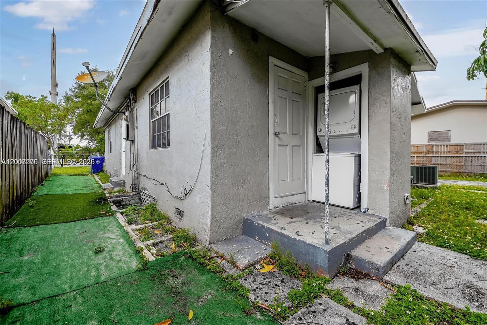 2800 Southwest 16th Terrace Miami, FL 33145 - Photo 8 of 17 a front view of a house with a yard