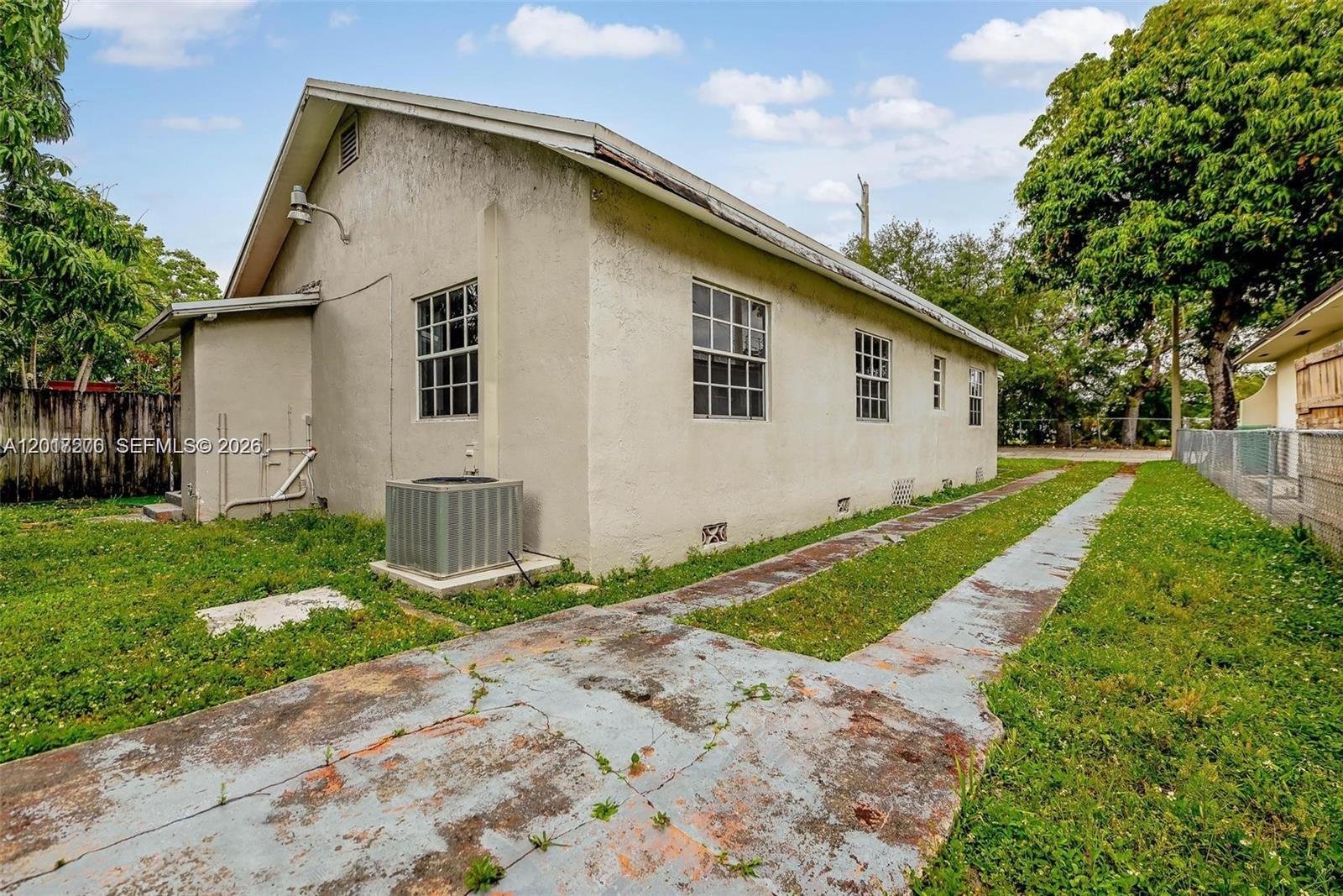 2800 Southwest 16th Terrace Miami, FL 33145 - Photo 9 of 17 a view of backyard of house with wooden fence