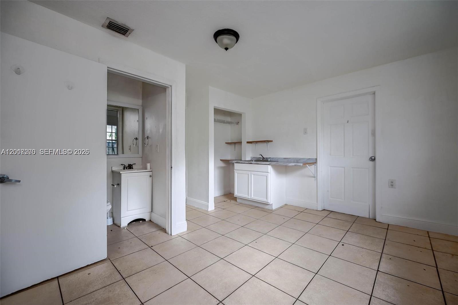 2800 Southwest 16th Terrace Miami, FL 33145 - Photo 10 of 17 a view of kitchen with white cabinets and sink