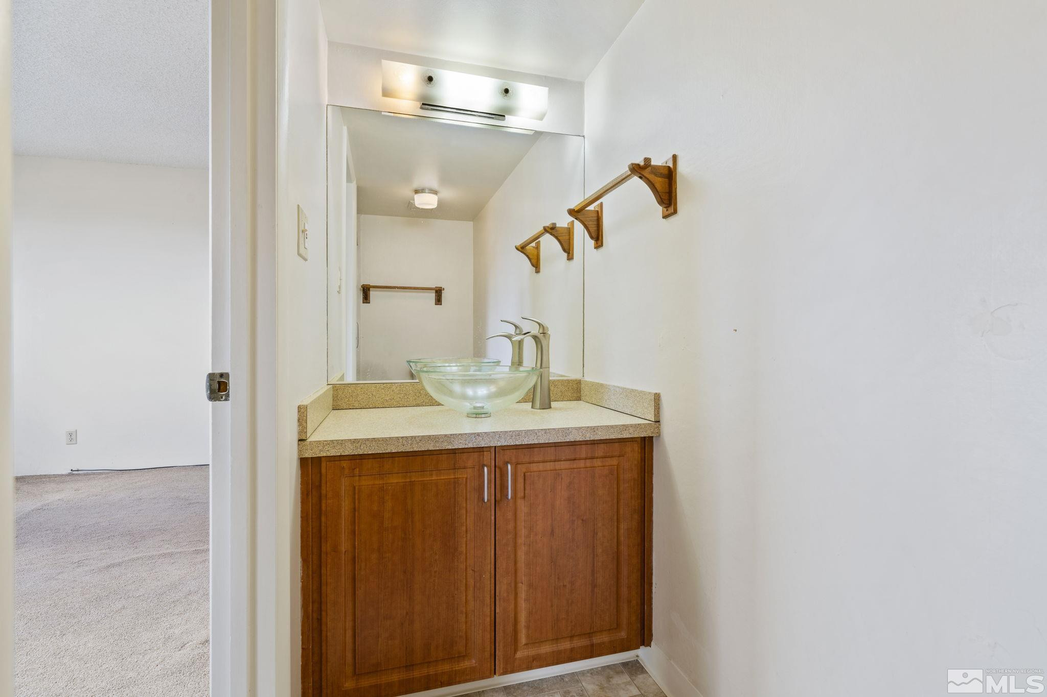 1508 Carlin Street Reno, NV 89503 - Photo 16 of 29 a bathroom with a sink and a mirror