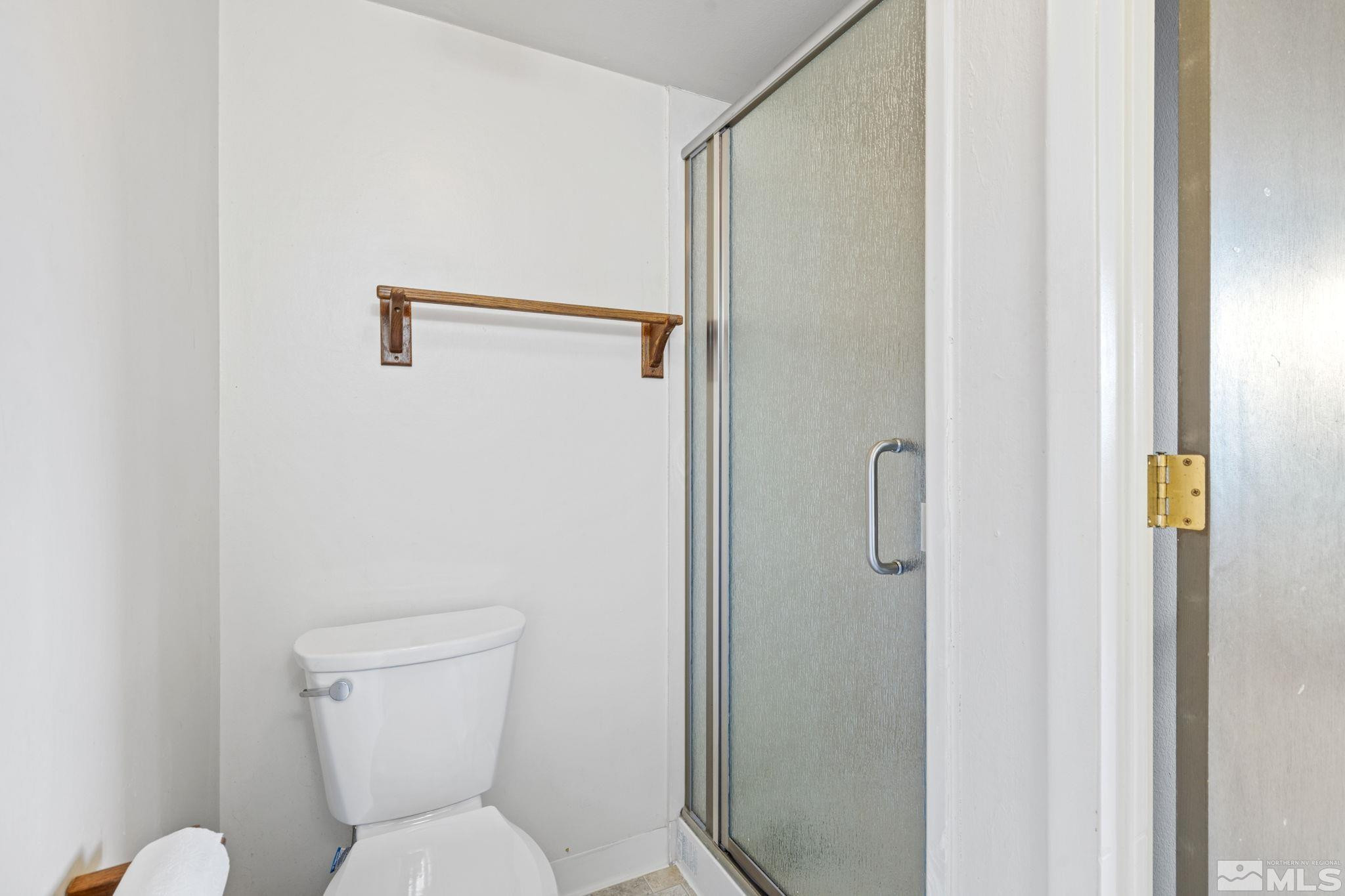 1508 Carlin Street Reno, NV 89503 - Photo 17 of 29 a white toilet sitting next to a bathroom