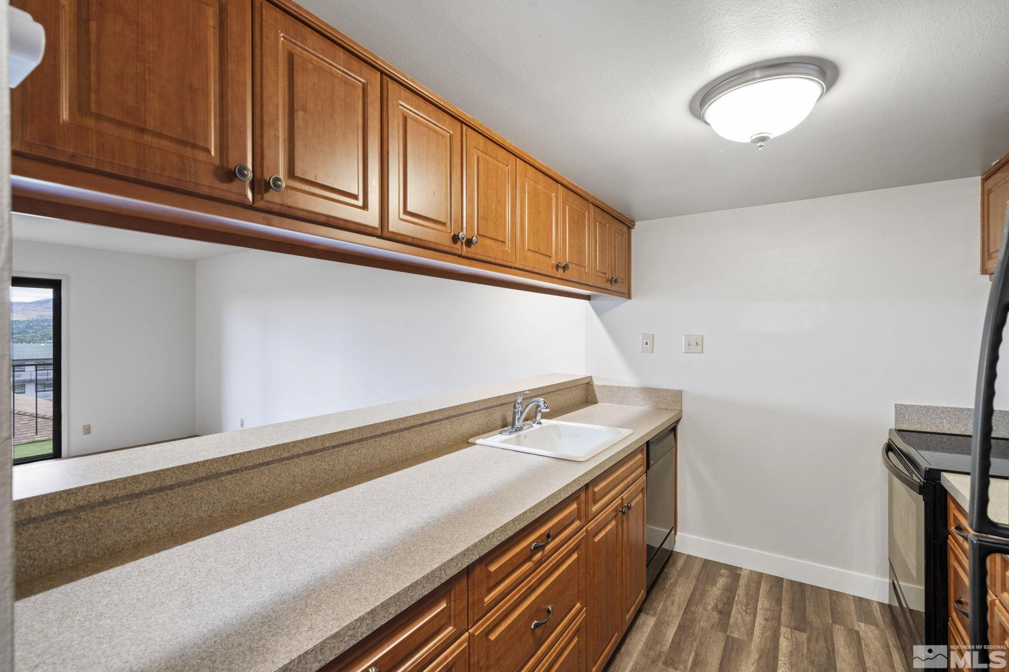 1508 Carlin Street Reno, NV 89503 - Photo 3 of 29 a kitchen with a sink and cabinets