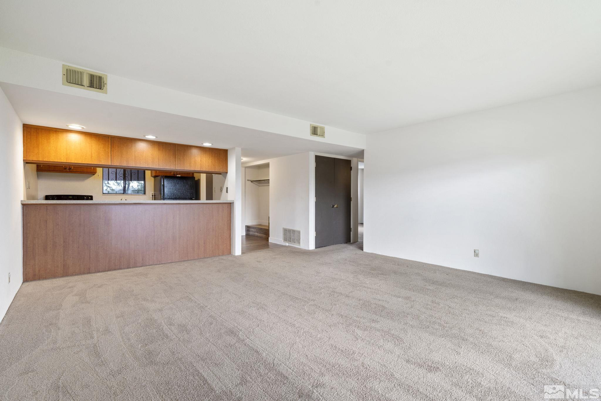 1508 Carlin Street Reno, NV 89503 - Photo 10 of 29 a view of a big room with wooden floor and windows