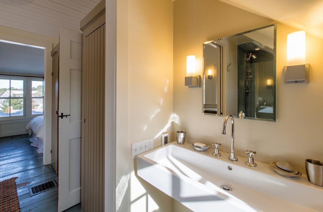 53 Depot Road Truro, MA 02666 - Photo 13 of 29 a bathroom with a sink and a mirror