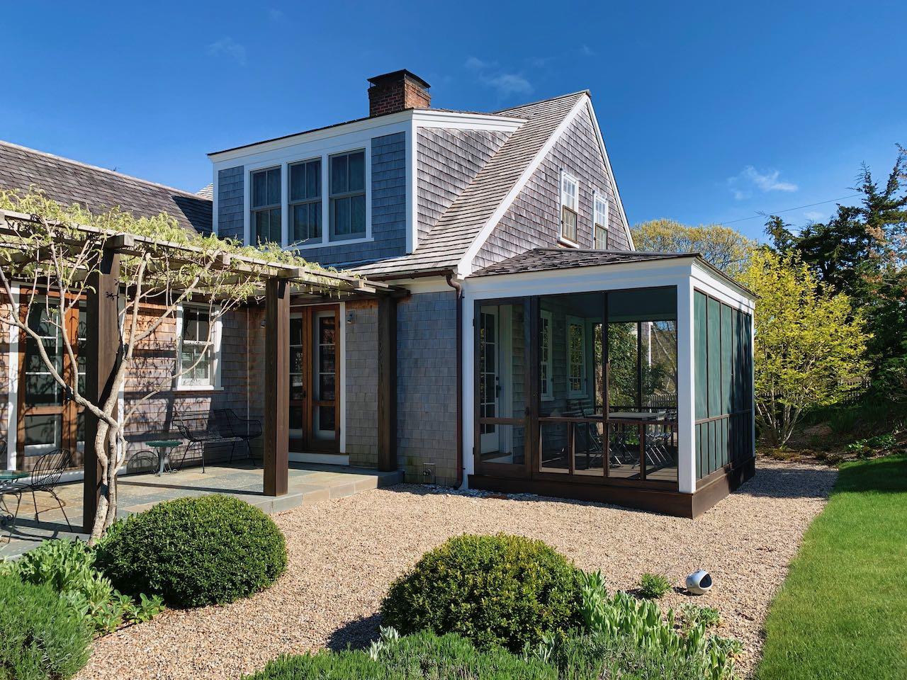 53 Depot Road Truro, MA 02666 - Photo 19 of 29 a view of a house with a yard and potted plants