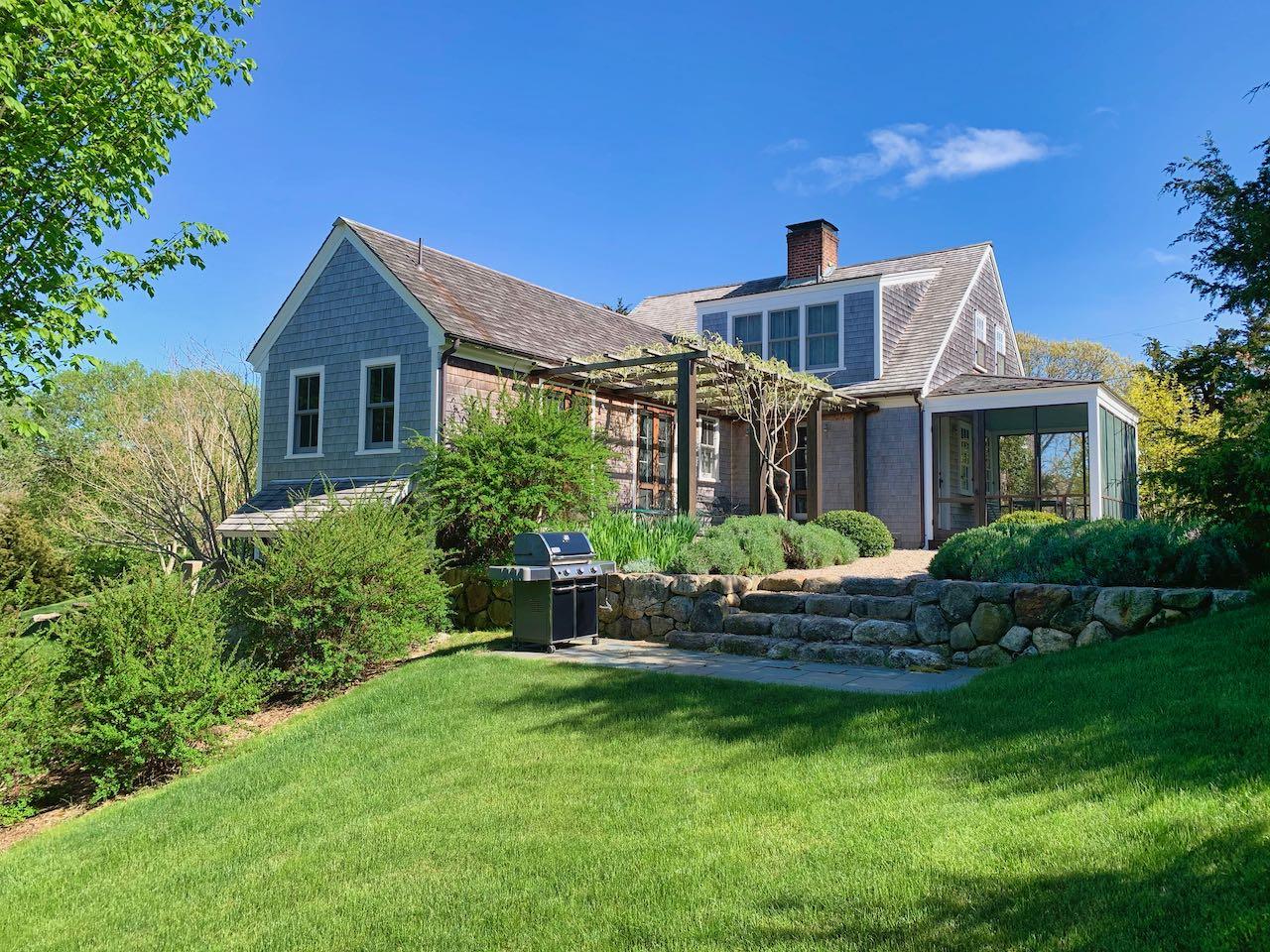 53 Depot Road Truro, MA 02666 - Photo 2 of 29 a front view of house with yard and green space